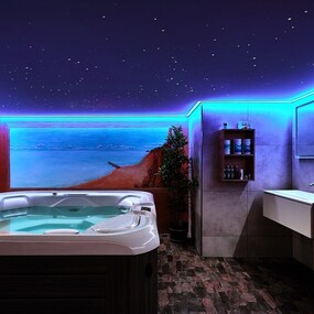 Modernes Wellnessbad mit Whirlpool, indirekter LED-Beleuchtung und Sternenhimmel-Optik.